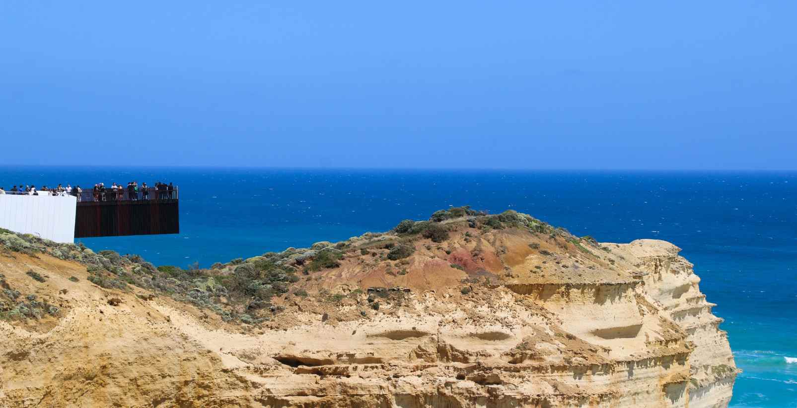 People on lookout point in distance