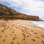 Footprints in the sand on bells beach